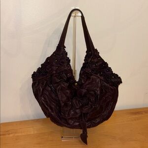 Stylish Plum Leather Handbag with Floral Accents